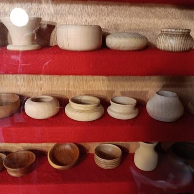MINIATURE WOODEN VESSELS HANDMADE BY OUR CLIENT IN A HANDMADE DISPLAY CASE