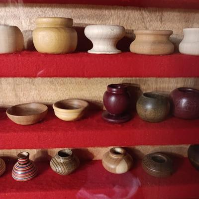 MINIATURE WOODEN VESSELS HANDMADE BY OUR CLIENT IN A HANDMADE DISPLAY CASE