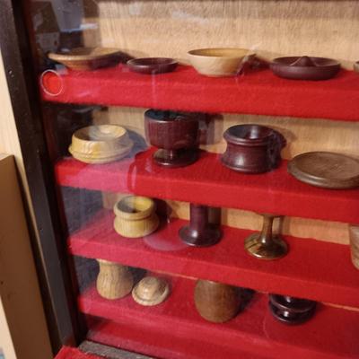MINIATURE WOODEN VESSELS HANDMADE BY OUR CLIENT IN A HANDMADE DISPLAY CASE