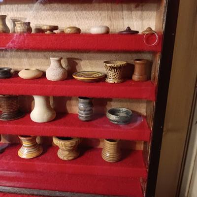 MINIATURE WOODEN VESSELS HANDMADE BY OUR CLIENT IN A HANDMADE DISPLAY CASE