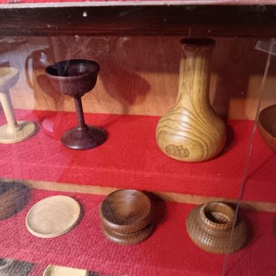 MINIATURE WOODEN VESSELS HANDMADE BY OUR CLIENT IN A HANDMADE DISPLAY CASE