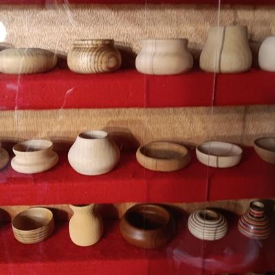 MINIATURE WOODEN VESSELS HANDMADE BY OUR CLIENT IN A HANDMADE DISPLAY CASE