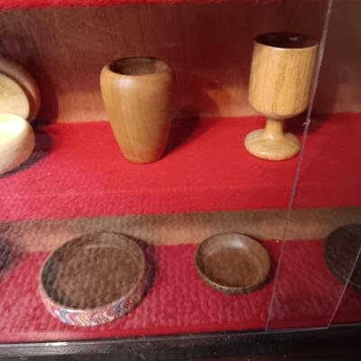 MINIATURE WOODEN VESSELS HANDMADE BY OUR CLIENT IN A HANDMADE DISPLAY CASE