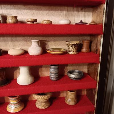 MINIATURE WOODEN VESSELS HANDMADE BY OUR CLIENT IN A HANDMADE DISPLAY CASE