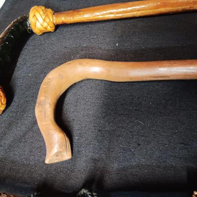 2 VINTAGE WOODEN CANES AND AN OLD UMBRELLA