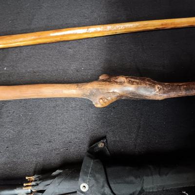 2 VINTAGE WOODEN CANES AND AN OLD UMBRELLA