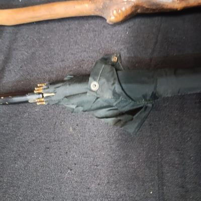2 VINTAGE WOODEN CANES AND AN OLD UMBRELLA