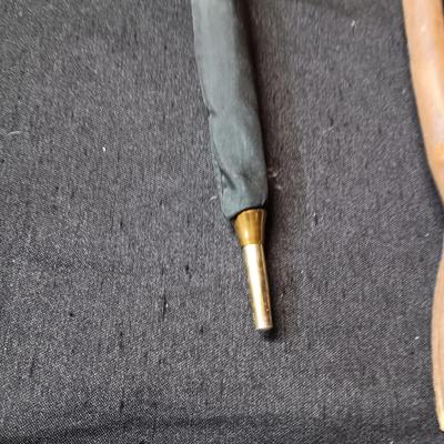 2 VINTAGE WOODEN CANES AND AN OLD UMBRELLA