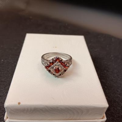 STERLING SILVER RING WITH GARNETS 5.70g SIZE 7 1/2 MARKED CNA