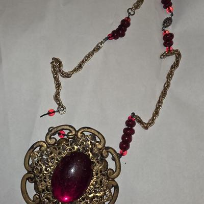 Ruby red and gold tone necklace