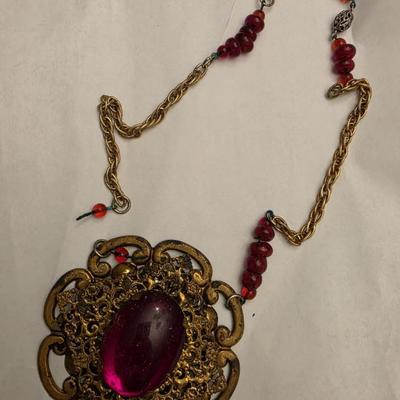 Ruby red and gold tone necklace