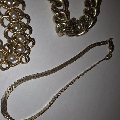 Three Gold Tone Bracelets