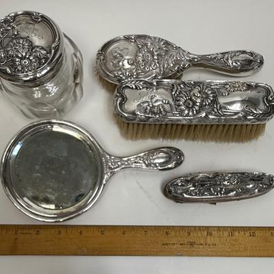 Sale Photo Thumbnail #625: In fair to good condition - there are dings and dents, and some deterioration of nail buffer pad, mirror clarity which is normal for the age of the pieces.. See photos for condition. All pieces are marked Sterling except for jar lid, but it looks like the