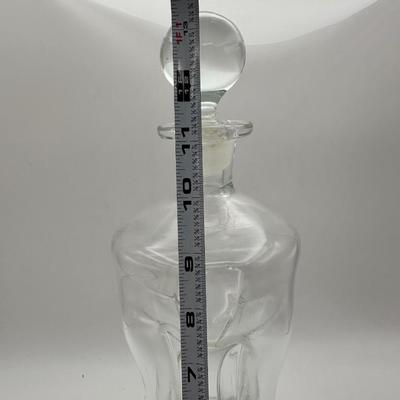Sale Photo Thumbnail #491: Also known as the “glug glug” bottle because of the distinctive sound it makes when liquid is poured from it. Designed by Jacob E Bang, Danish, pinched 3 column design, mouth-blown clear glass.