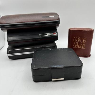 Sale Photo Thumbnail #586: Norelco and Schick over the years! Electric razors in original cases.