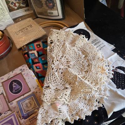 Sale Photo Thumbnail #39: Lot of craft/ sewing items including embroidery hoops/aida cloth/patterned fabric/sewing thread/large doilies