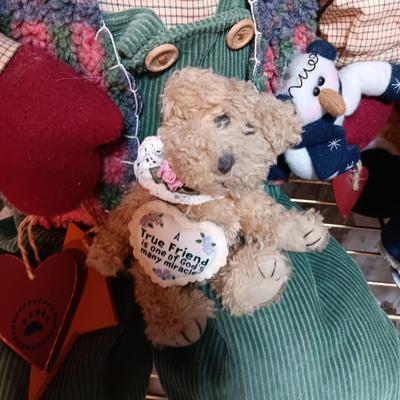 A COLLECTION OF PLUSH ANIMALS WITH A TOTE