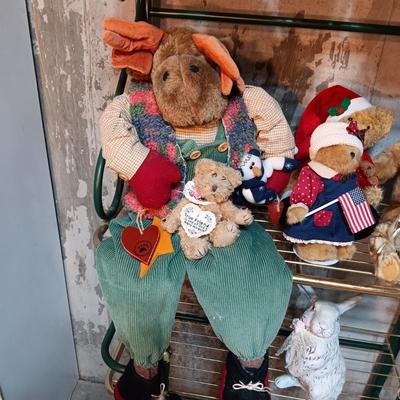 A COLLECTION OF PLUSH ANIMALS WITH A TOTE