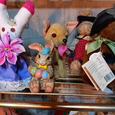 A COLLECTION OF PLUSH ANIMALS WITH A TOTE