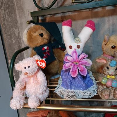 A COLLECTION OF PLUSH ANIMALS WITH A TOTE
