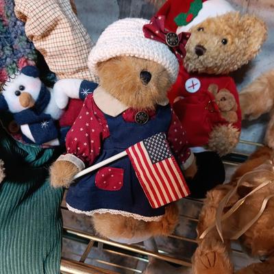 A COLLECTION OF PLUSH ANIMALS WITH A TOTE