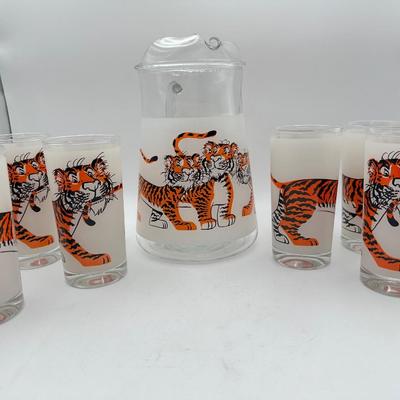 Sale Photo Thumbnail #413: 1960’s promotional items from Exxon Gas “Put a Tiger in Your Tank”, frosted glass with tiger chasing its tail.