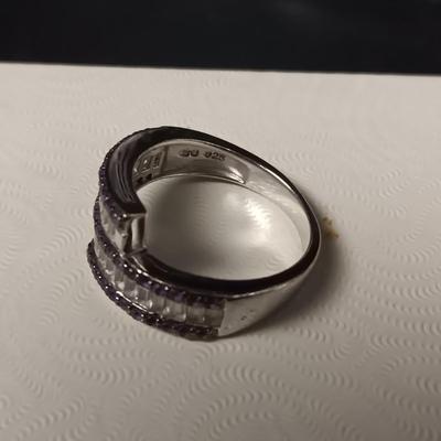 STERLING SILVER RING W/PURPLE AND CLEAR BAGUETTE STONES AND A STERLING RING WITH A BLUE STONE