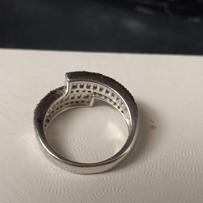 STERLING SILVER RING W/PURPLE AND CLEAR BAGUETTE STONES AND A STERLING RING WITH A BLUE STONE