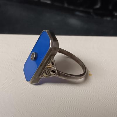 STERLING SILVER RING W/PURPLE AND CLEAR BAGUETTE STONES AND A STERLING RING WITH A BLUE STONE