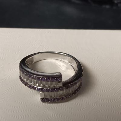 STERLING SILVER RING W/PURPLE AND CLEAR BAGUETTE STONES AND A STERLING RING WITH A BLUE STONE