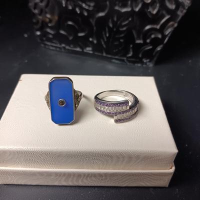 STERLING SILVER RING W/PURPLE AND CLEAR BAGUETTE STONES AND A STERLING RING WITH A BLUE STONE