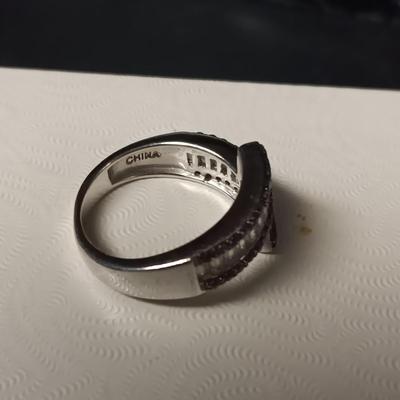 STERLING SILVER RING W/PURPLE AND CLEAR BAGUETTE STONES AND A STERLING RING WITH A BLUE STONE