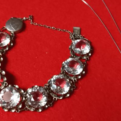 STERLING SILVER CHAIN AND PENDANT PLUS A STERLING BRACELET WITH GLASS STONES
