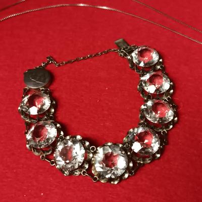 STERLING SILVER CHAIN AND PENDANT PLUS A STERLING BRACELET WITH GLASS STONES