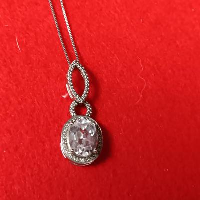 STERLING SILVER CHAIN AND PENDANT PLUS A STERLING BRACELET WITH GLASS STONES