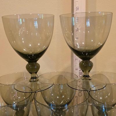LOT 26K: Incomplete Set Of Circa 1980's, Smokey Colored Glasses, 12 Champagne Goblets, 10 Wine Goblets, & 2 Small Goblets