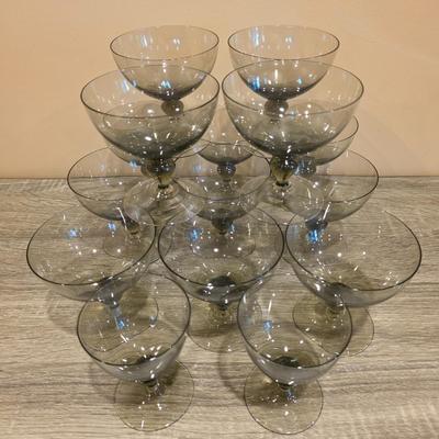 LOT 26K: Incomplete Set Of Circa 1980's, Smokey Colored Glasses, 12 Champagne Goblets, 10 Wine Goblets, & 2 Small Goblets