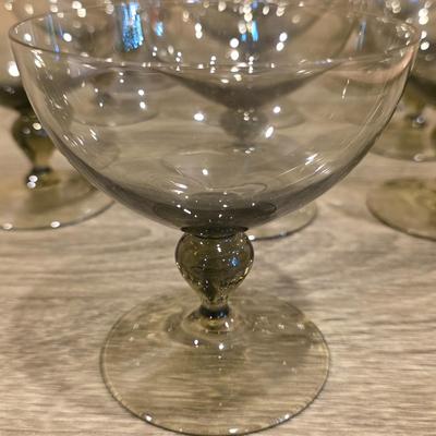 LOT 26K: Incomplete Set Of Circa 1980's, Smokey Colored Glasses, 12 Champagne Goblets, 10 Wine Goblets, & 2 Small Goblets