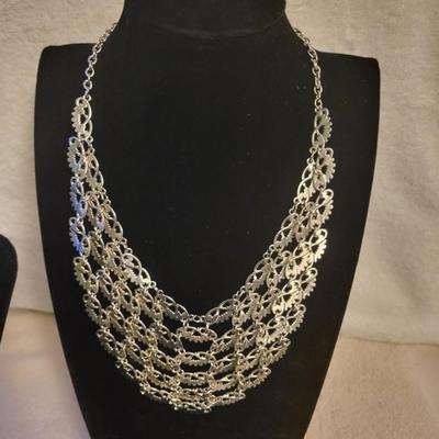 2 SILVER-TONE NECKLACES AND A PAIR OF EARRINGS