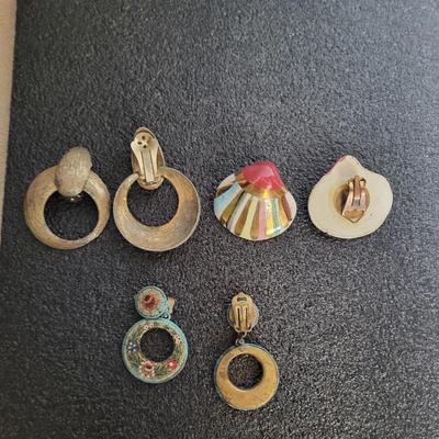 3 CLIP ON EARRINGS AND A BROOCH