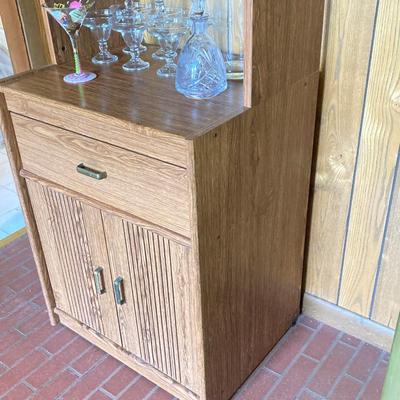 LOT 75: Cabinet / Bar with Contents and Large Collection of Glasses, Decanters, Pitchers and More