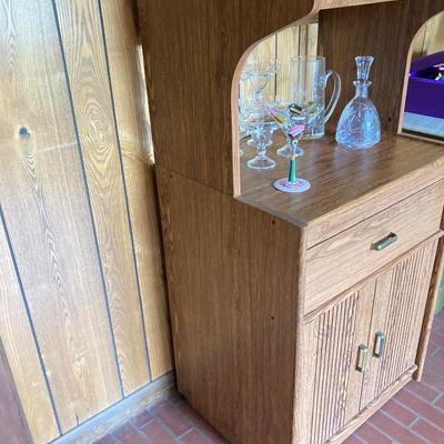 LOT 75: Cabinet / Bar with Contents and Large Collection of Glasses, Decanters, Pitchers and More
