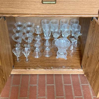 LOT 75: Cabinet / Bar with Contents and Large Collection of Glasses, Decanters, Pitchers and More