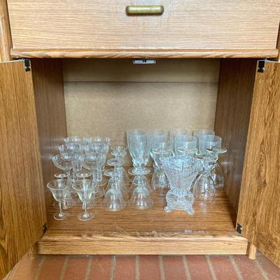 LOT 75: Cabinet / Bar with Contents and Large Collection of Glasses, Decanters, Pitchers and More