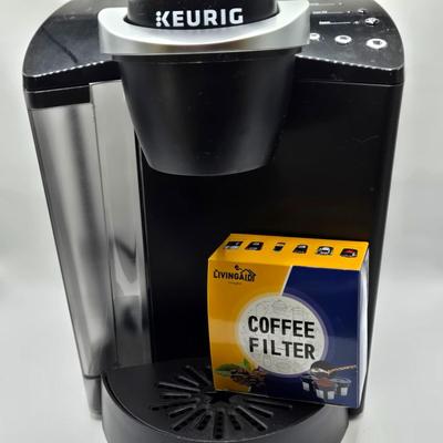 LOT 128: I Love Lucy and Lucy Loves Muffins/ Keurig Coffee Maker, Muffin Maker, "Lucy" Items, Coffee Sign, and Clock