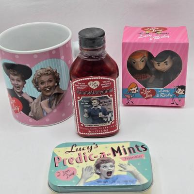 LOT 128: I Love Lucy and Lucy Loves Muffins/ Keurig Coffee Maker, Muffin Maker, "Lucy" Items, Coffee Sign, and Clock