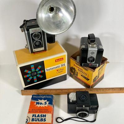LOT 180: Vintage Cameras - Kodak Instamatic M4, Brownie Hawkeye, Duaflex III, Revere Automatic 500, Westinghouse No. 5 Flash Bulbs and More
