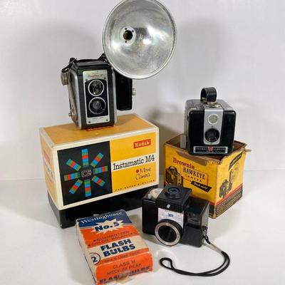 LOT 180: Vintage Cameras - Kodak Instamatic M4, Brownie Hawkeye, Duaflex III, Revere Automatic 500, Westinghouse No. 5 Flash Bulbs and More
