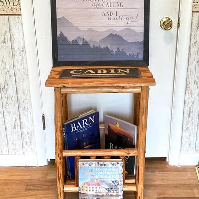 LOT 188: Handcrafted Log Style Side Table, Mountains / Cabin Wall Decor and Collection of Books