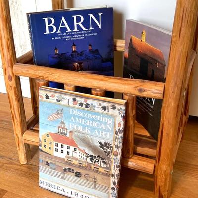 LOT 188: Handcrafted Log Style Side Table, Mountains / Cabin Wall Decor and Collection of Books